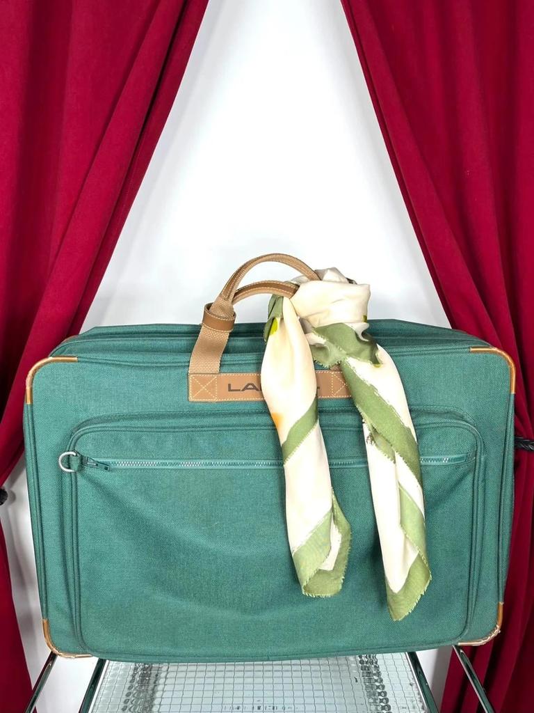 Vintage green Lancel travel bag in fabric and leather