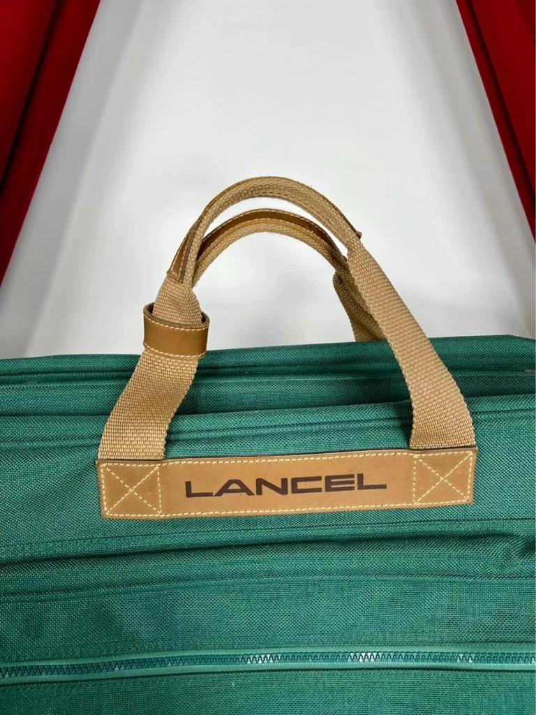 Vintage green Lancel travel bag in fabric and leather