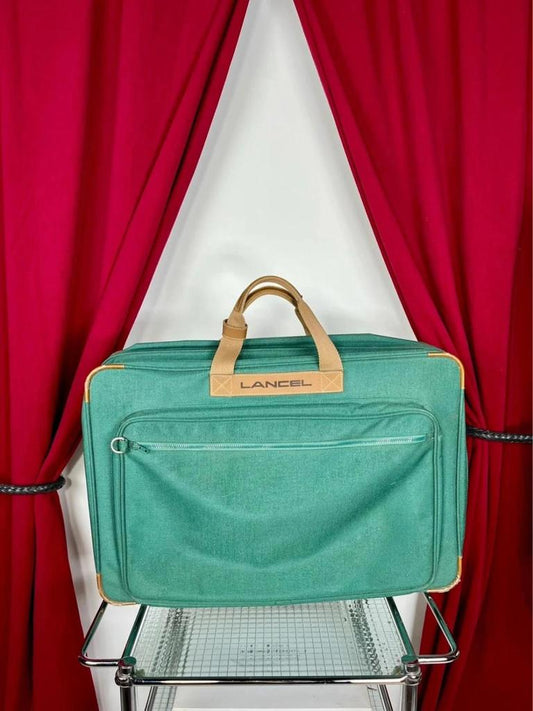 Vintage green Lancel travel bag in fabric and leather