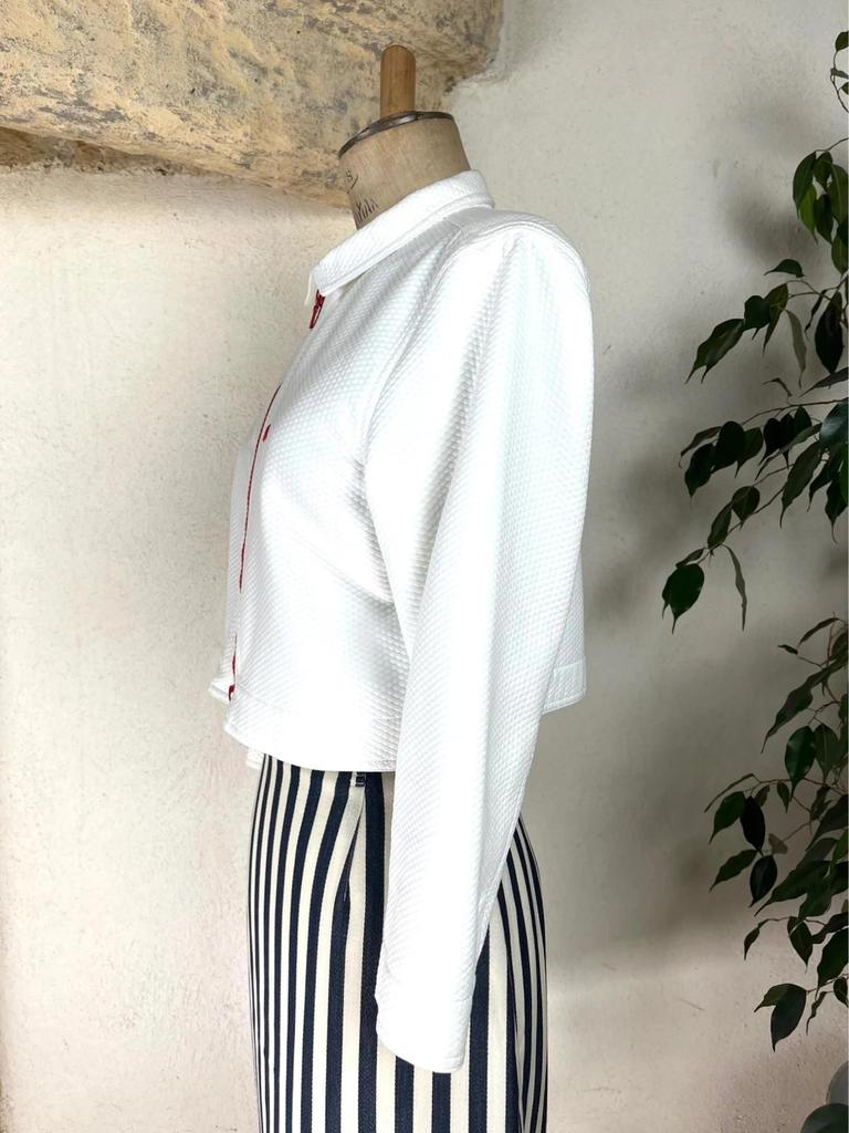 Veste Courrèges blanche à fermeture éclair rouge